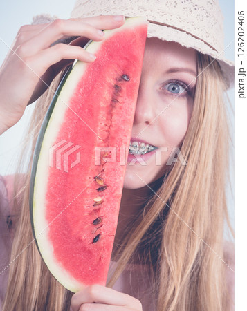 woman holding watermelon fruit 126202406