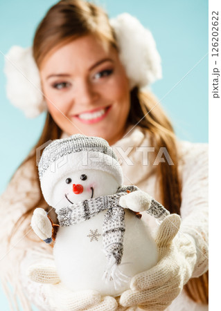 Girl with xmas snowman. 126202622
