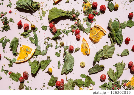 Scattered Dried Leaves, Berries and Orange Slices. Ingredients for Herbal Tea and Concept of Natural Wellness. 126202819