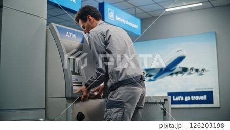 Technician Servicing ATM Machine in Modern Airport Terminal 126203198