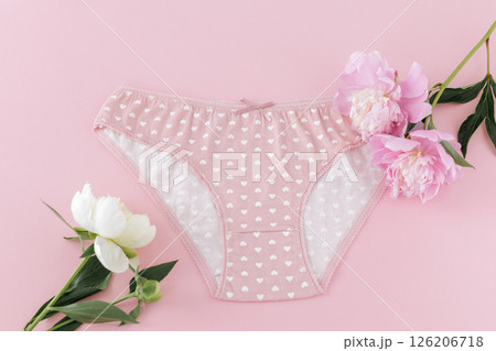 Pink cotton women's panties on the pink background. Pink cotton women's panties on the pink background. 126206718