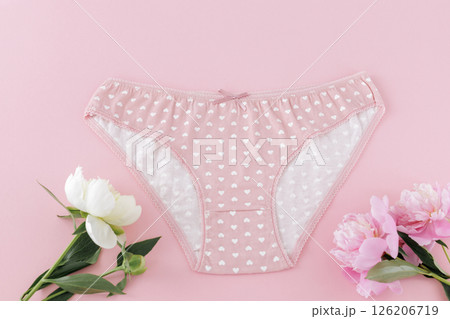 Pink cotton women's panties on the pink background. Pink cotton women's panties on the pink background. 126206719