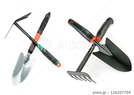 Garden shovel and rake isolated on white background. 126207704