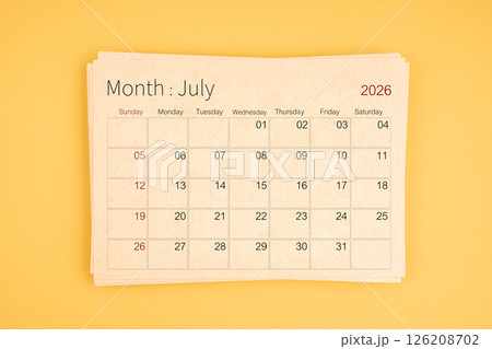 July 2026 calendar from brown recycle paper on yellow background. 126208702