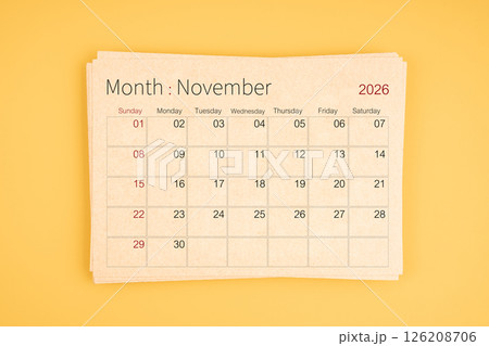 November 2026 calendar from brown recycle paper on yellow background. 126208706