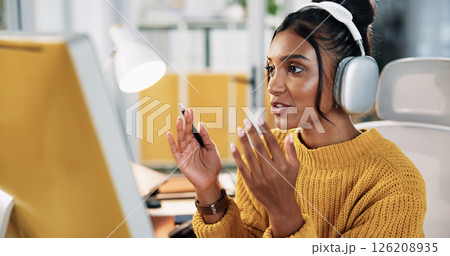 Computer, headphones and business woman on video call for communication with social media analyst. Webinar, virtual meeting and creative worker talk with tech for engagement results in startup office 126208935