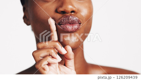 Beauty, lip scrub and cosmetics with black woman in studio for exfoliation, spa treatment and skincare. Sugar, facial and dermatology with closeup of person on white background for self care 126209439