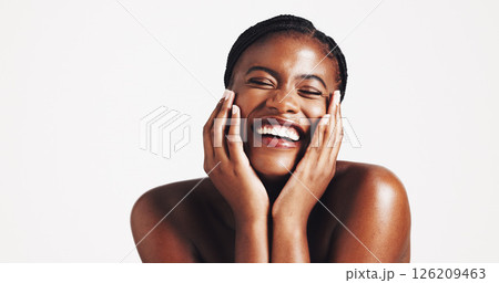 Makeup, shine or black woman with smile for skincare, portrait or acne solution on white background. Studio space, playful or face of happy African girl model with confidence, beauty mockup or glow Makeup, shine or black woman with smile for skincare, portrait or acne solution on white background. Studio space, playful or face of happy African girl model with confidence, beauty mockup or glow 126209463