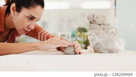 Pottery, artist and woman in workshop with clay for design, sculpture and learning skills in studio. Creative, small business and person with ceramic object for DIY hobby, craft and handmade mold 126209484