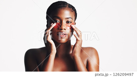 Black woman, portrait and eye patches with collagen or hydration on a white studio background. Face, female person or model with facial gel mask or cosmetics for dermatology or anti aging treatment 126209497