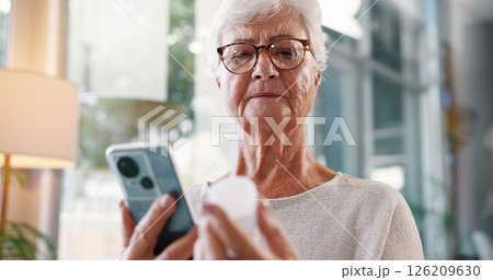 Elderly woman, research and medication with phone for telehealth, information or prescription at home. Senior, female person or patient with mobile smartphone or pills for symptoms or side effects Elderly woman, research and medication with phone for telehealth, information or prescription at home. Senior, female person or patient with mobile smartphone or pills for symptoms or side effects 126209630