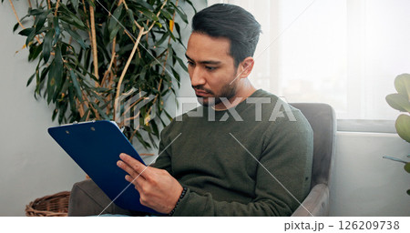 Waiting room, clinic and man with clipboard for writing information, insurance form and medical history. Healthcare, hospital and person with checklist for wellness, appointment and consultation Waiting room, clinic and man with clipboard for writing information, insurance form and medical history. Healthcare, hospital and person with checklist for wellness, appointment and consultation 126209738