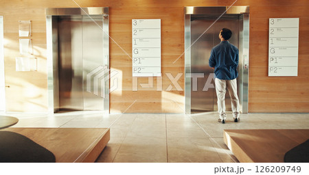 Business, man and waiting at elevator in building for floor request, meeting appointment and destination. Back, professional person and office lift for work arrival, departure and morning routine Business, man and waiting at elevator in building for floor request, meeting appointment and destination. Back, professional person and office lift for work arrival, departure and morning routine 126209749