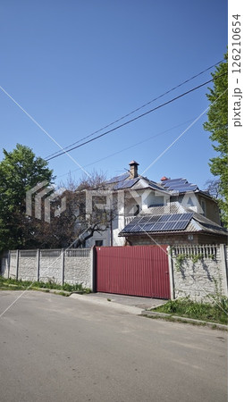 Modern house with solar panels on the roof 126210654