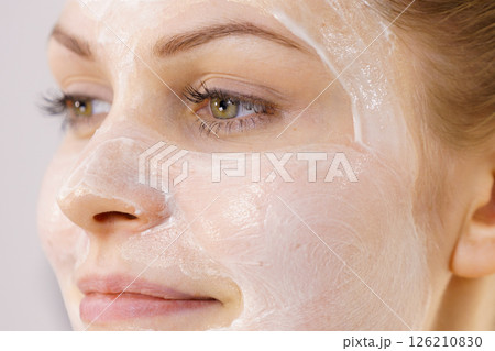 Girl with cream moisture cosmetic on face Girl with cream moisture cosmetic on face 126210830