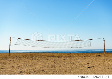 Volleyball net on sandy beach. 126211081
