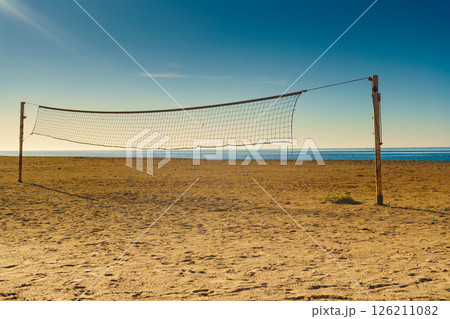 Volleyball net on sandy beach. 126211082