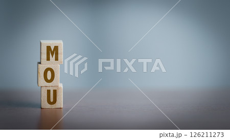 Wooden cubes with the word MOU on wooden table. 126211273