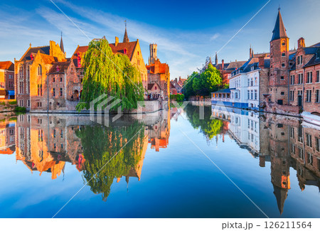 Bruges, Belgium. Rozenhoedkaai in golden hour water canal reflection 126211564