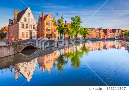 Bruges, Belgium. Spiegelrei canal, sunrise water reflection in Brugge. 126211567