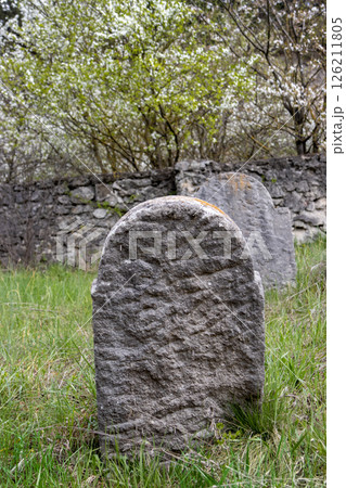 Tombstone at an abandoned jewish cemetery, Slovakia Tombstone at an abandoned jewish cemetery, Slovakia 126211805