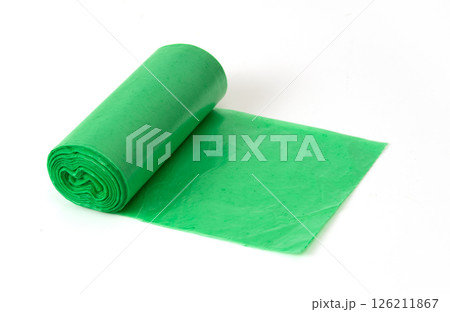 Green plastic garbage bag roll unrolled on white background, household waste bag for cleaning or trash disposal. 126211867