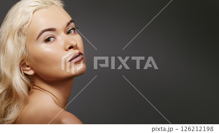 Sexy blond woman in retro style. Beautiful woman model in femininity pose with fashion make-up, soft skin, hairstyle Sexy blond woman in retro style. Beautiful woman model in femininity pose with fashion make-up, soft skin, hairstyle 126212198