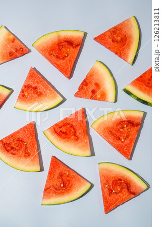 Watermelon triangle slices blue background 126213811