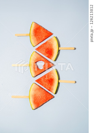Watermelon slices isolated on blue background 126213812