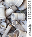 Messy pile of white PVC plumbing fittings and pipes discarded after use Messy pile of white PVC plumbing fittings and pipes discarded after use 126213908