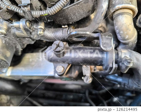 Exploring the intricate details of an automotive engine during routine maintenance on a sunny afternoon 126214495