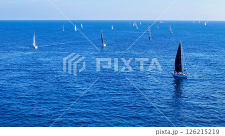 Sailboats glide gracefully across the shimmering blue waters during a serene afternoon in the open sea Generative AI Sailboats glide gracefully across the shimmering blue waters during a serene afternoon in the open sea Generative AI 126215219