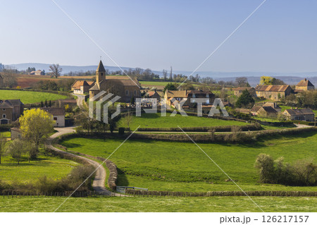 La Chapelle sous Brancion in Bourgogne Franche Comte showing its church, cemetery and surrounding fields in spring La Chapelle sous Brancion in Bourgogne Franche Comte showing its church, cemetery and surrounding fields in spring 126217157