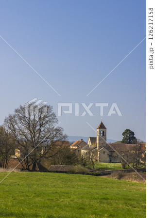 Chapaize in Saone et Loire, Bourgogne Franche Comte, France, showing its church and surrounding countryside landscape 126217158