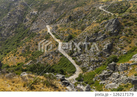 Winding road crossing rocky landscape in Gredos Regional Park, Avila, Spain 126217179