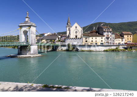 Seyssel suspension bridge over turquoise Rhone River in Ain, France, with church and colorful houses Seyssel suspension bridge over turquoise Rhone River in Ain, France, with church and colorful houses 126217240