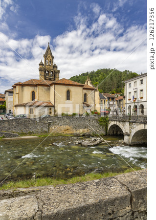 Church of Seix reflecting in the waters of the Salat river in Ariege, France 126217356
