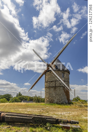 Old windmill standing in La Possonniere, France, under blue sky 126217368