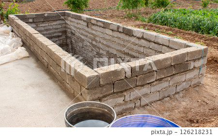 The process of building a home pool for storing water 126218231
