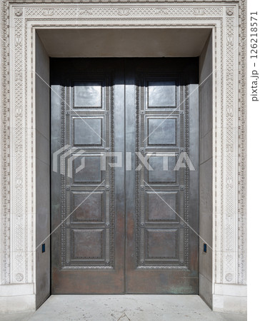 Old building entrance door details with Decorated carved on the exterior wall of the Freemasons' Hall. 126218571