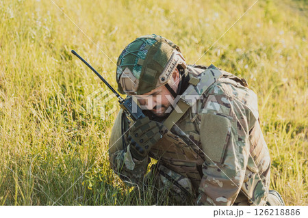 Soldier On War Communicating With Walkie Talkie  126218886