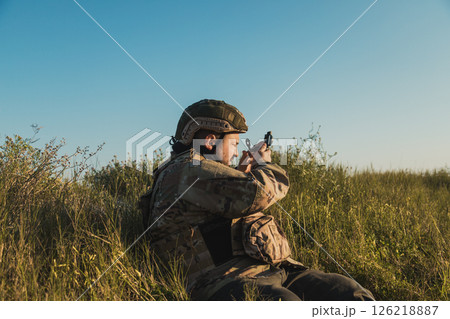 Mercenary Soldier During A Mission In The Nature  126218887