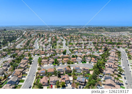 Aerial view of San Marcos neighborhood, with houses and street. South California 126219317