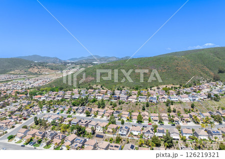 Aerial view of San Marcos neighborhood, with houses and street. South California 126219321
