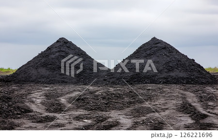 Twin Pyramids of Refined Carbon Residue Under a Muted Sky Vista Twin Pyramids of Refined Carbon Residue Under a Muted Sky Vista 126221696