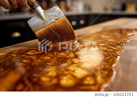 Crafting beauty, Applying finish to a wooden surface with a brush stroke 126221721
