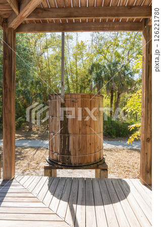 Old wooden barrel under rustic shelter 126221780