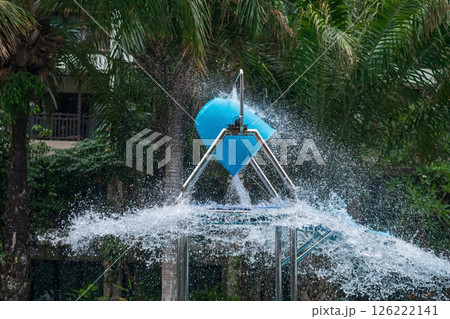 Water bucket splash water at swimming pool in hotel, Pattaya Water bucket splash water at swimming pool in hotel, Pattaya 126222141