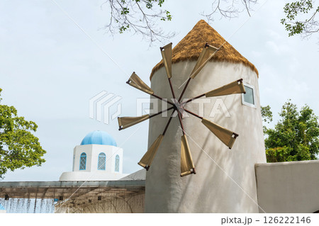 Windmill attached in modern building as restaurant bybeach 126222146