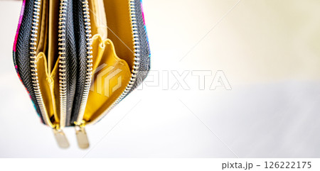 Fashionable outdoor women's empty purse, on a white background, copy space to the right Fashionable outdoor women's empty purse, on a white background, copy space to the right 126222175